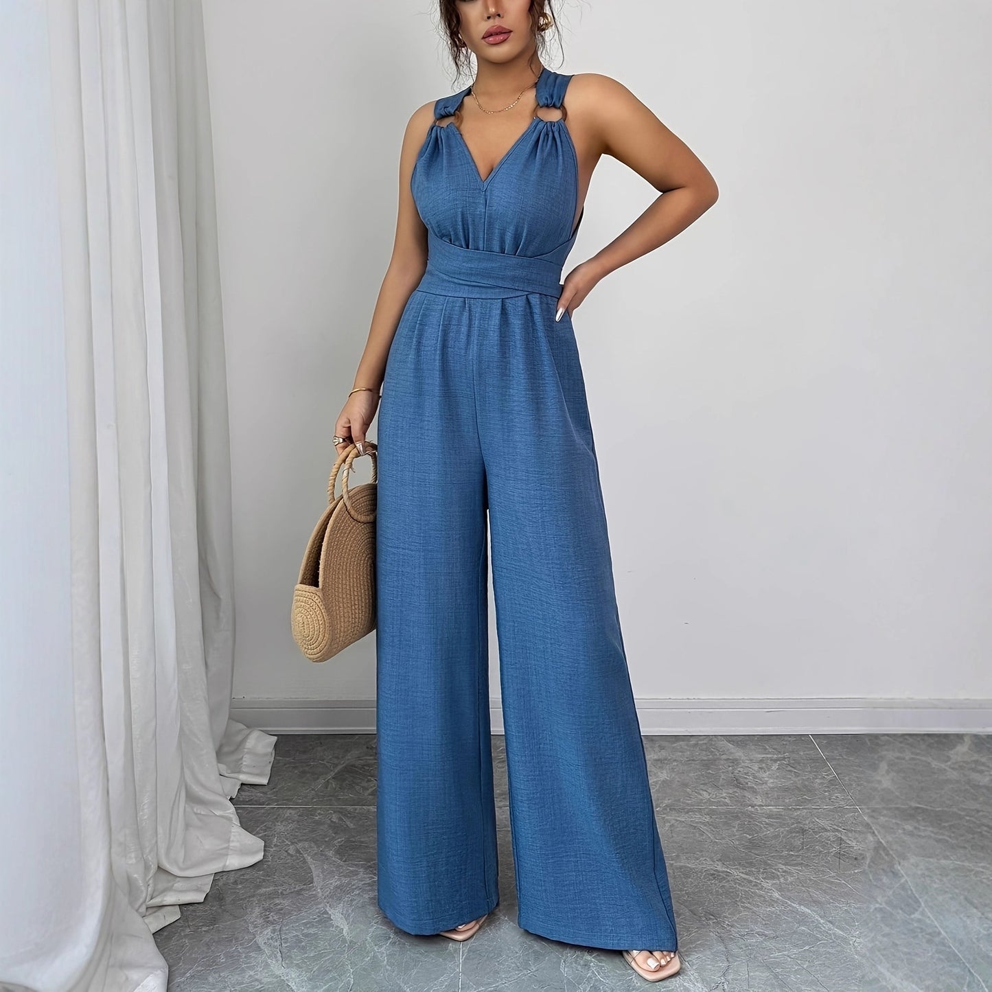 V-udskæring, rygløs, crossover-talje, viddebenet jumpsuit