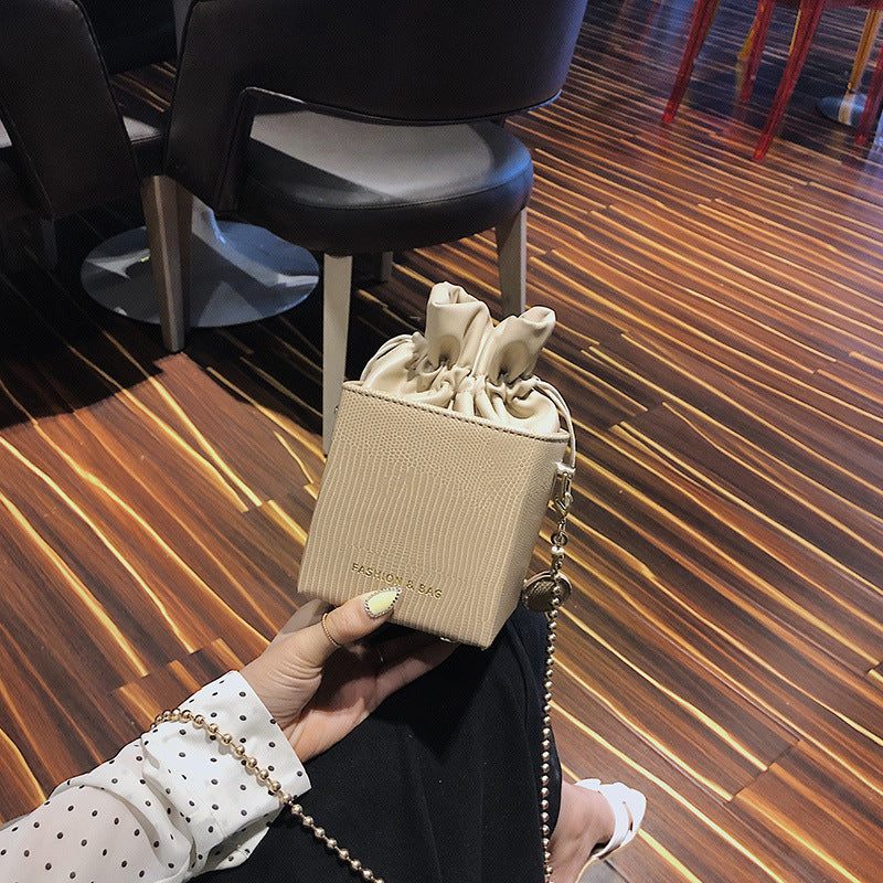 Chain drawstring crossbody bag