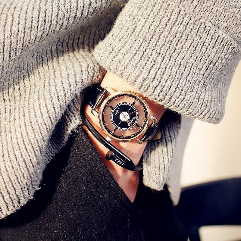 Double-sided cross cutout watch
