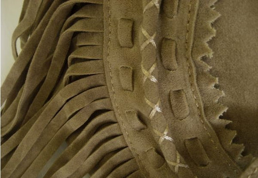 Suede fringe diagonal across package
