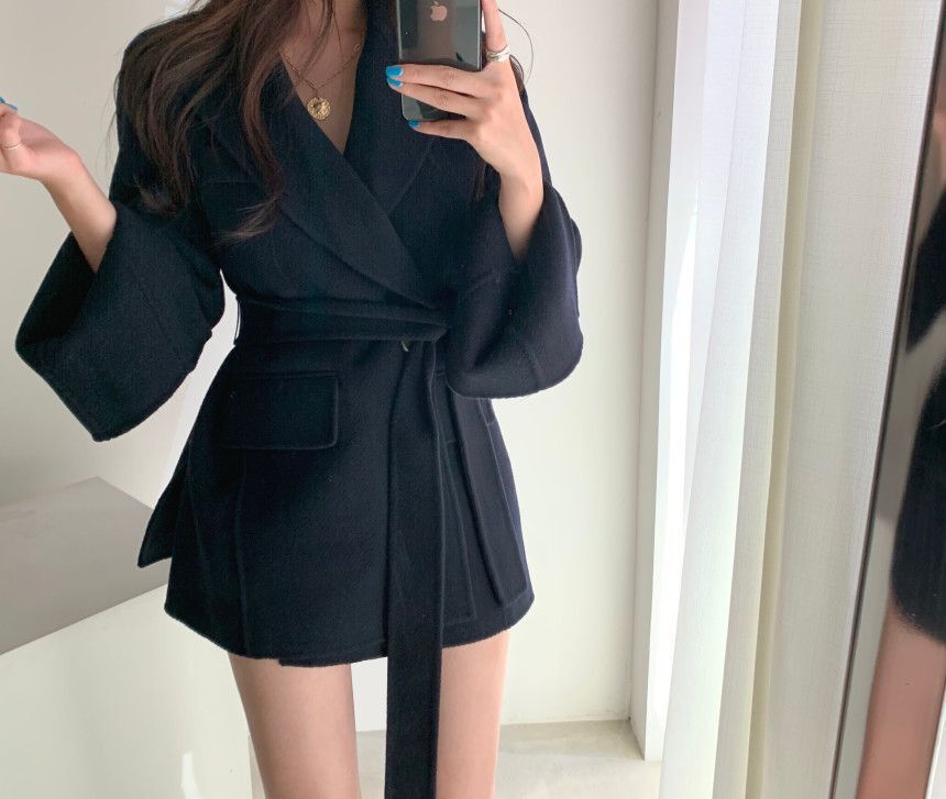 A buckle lace up waist slimming long sleeve woolen coat