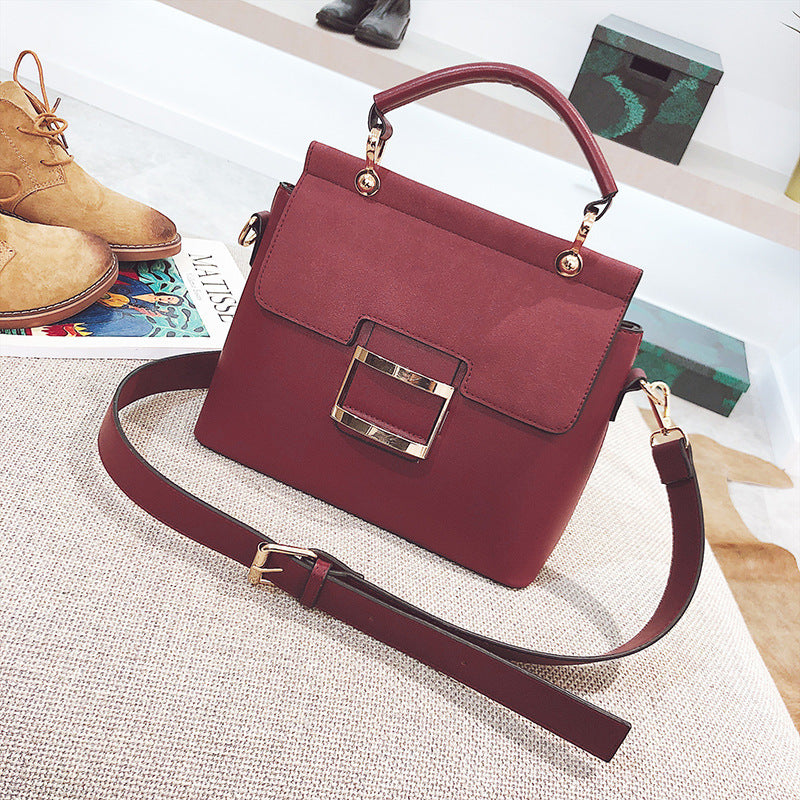 Small square bag with wide shoulder strap and cross-body