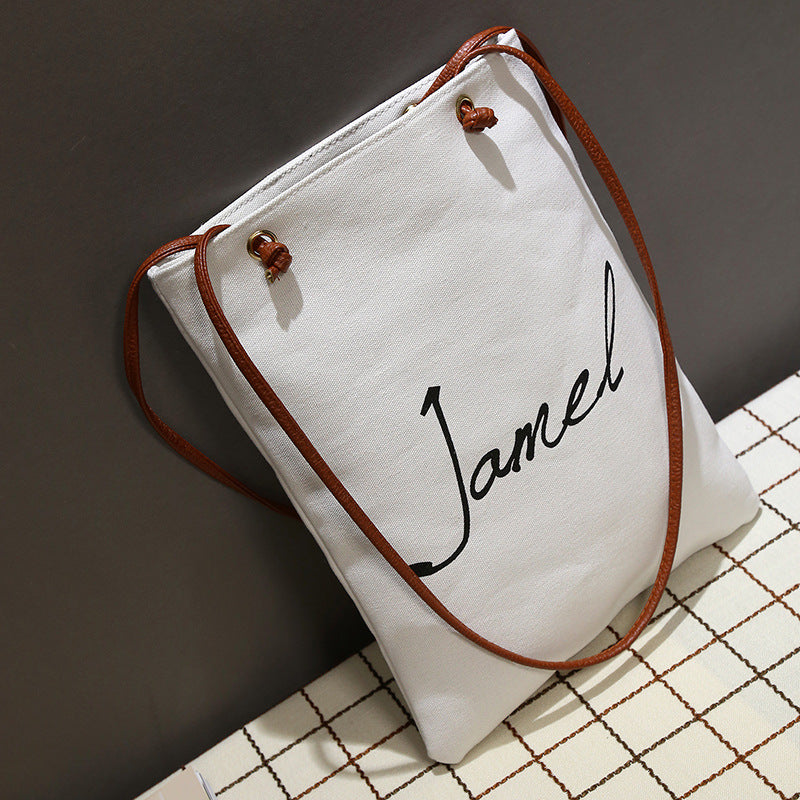The new Korean alphabet printed Canvas Handbag Shoulder canvas bag student bag female canvas bag cloth female fashion tide