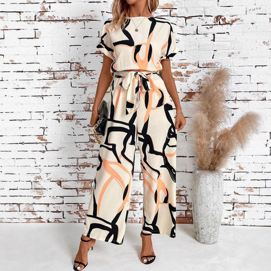 Dame retro-jumpsuit med mønster, talje og elegant pasform og korte ærmer