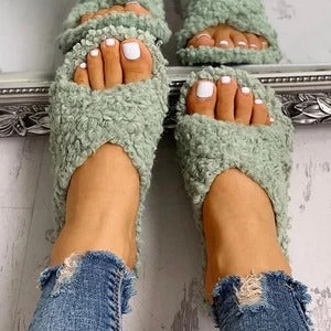 Cross hairy slippers to keep warm at home
