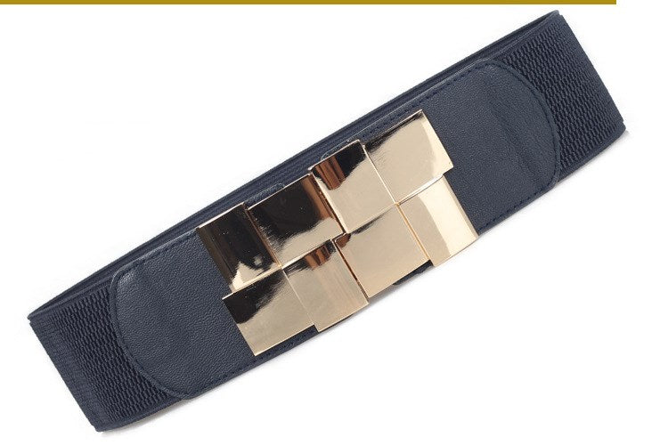The lady's loose skirt has a wide belt