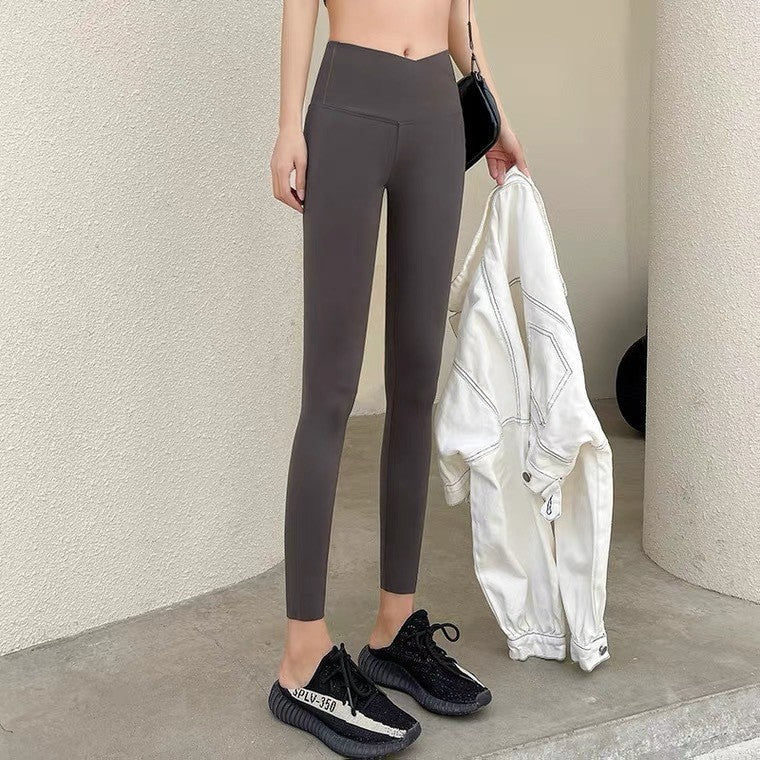 Dame-leggings med kryds i taljen i hajskindsstof