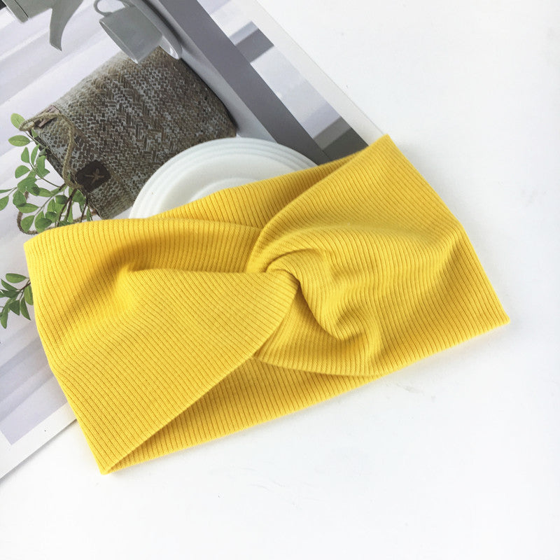 Wide side stretch knitted headband