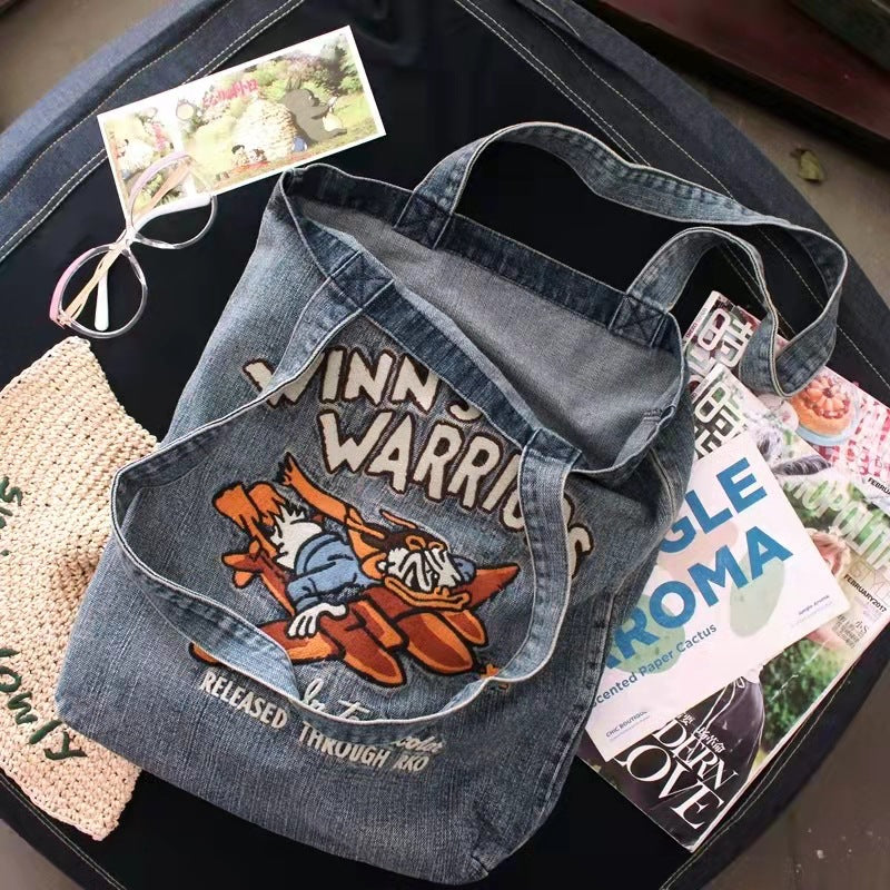 Skuldertaske i kunststof med vintagelook og vask