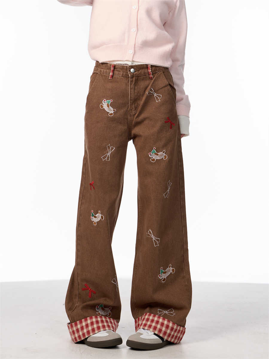 Vintage jeans med broderet sløjfe, hvalpemotiv og vide ben samt høj talje