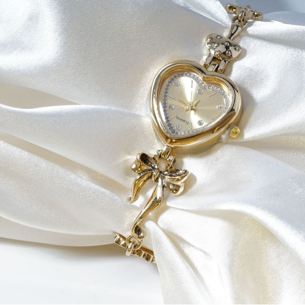Retro Heart-shaped Bracelet Watch With A Golden Bow And Flower Design A Stylish Womens Timepiece