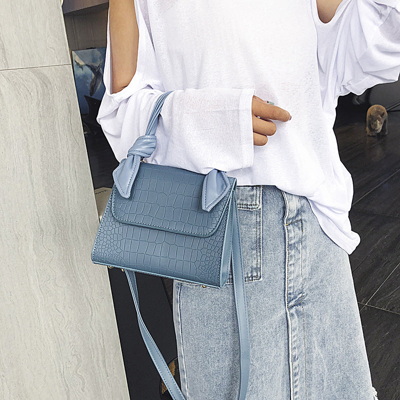 Stone-grained shoulder-slung crossbody bag