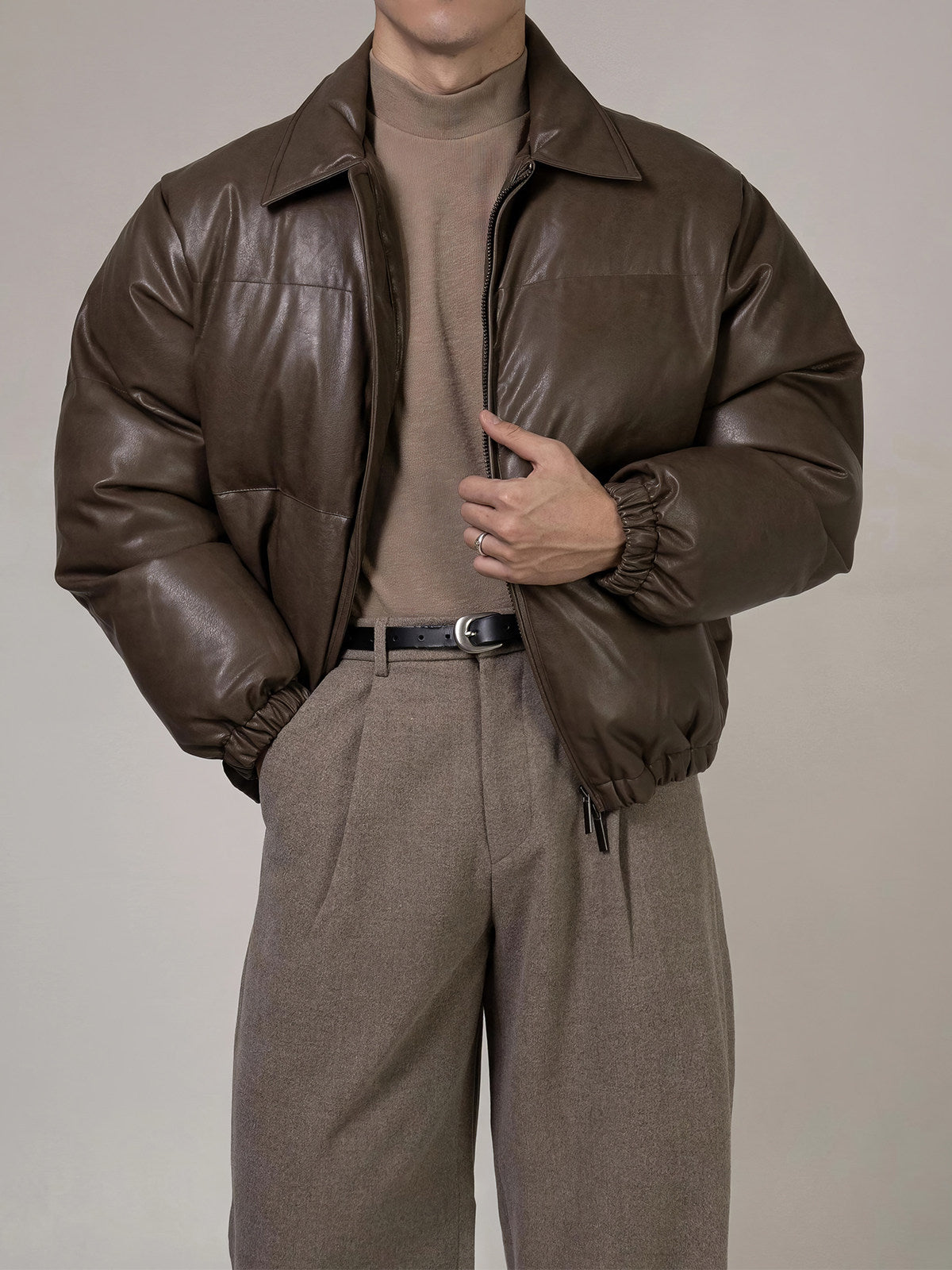 PU Leather Puffer Jacket With A Stand-up Collar And Extra Padding