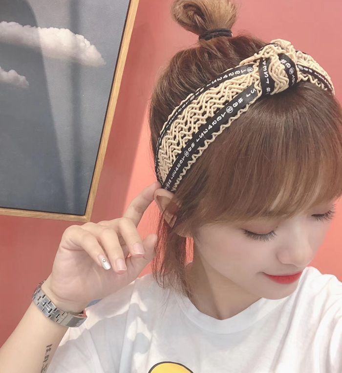 Handmade twisted letter ribbon with knotted headband in the middle
