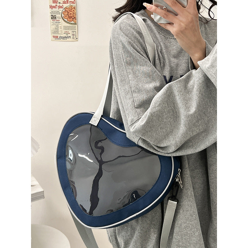 Enkel alt-matchende hjerteformet gennemsigtig hånd-crossbody-taske