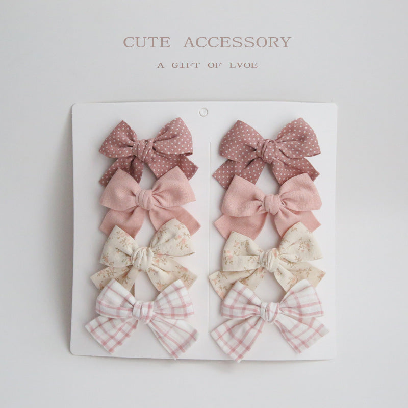 Dovetail Bow Around A Pair Of Hairclips 1 Group