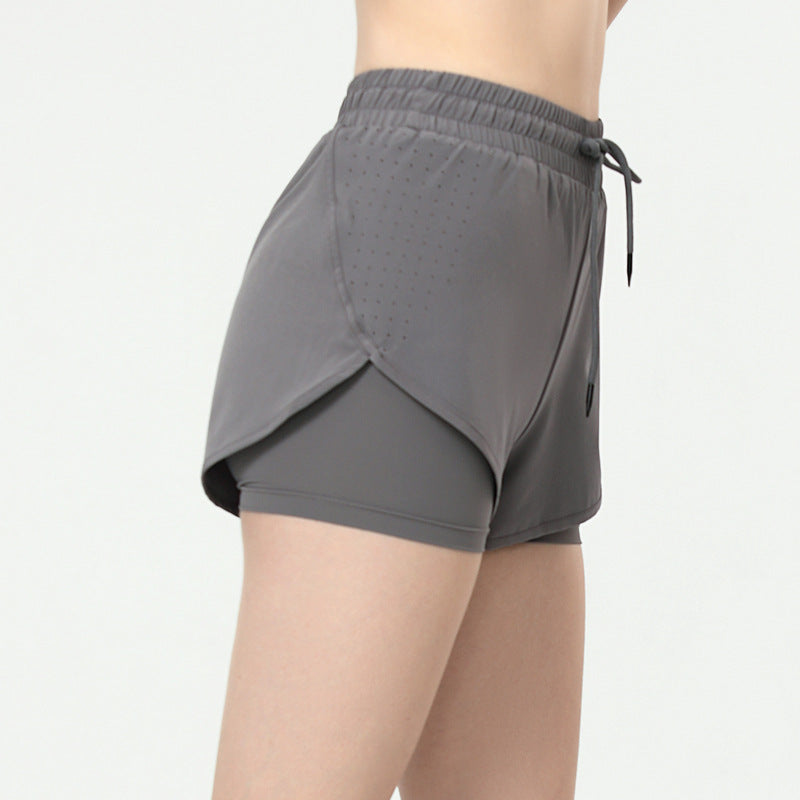 Sportsshorts til kvinder med to-i-én-effekt – forhindrer blottelse
