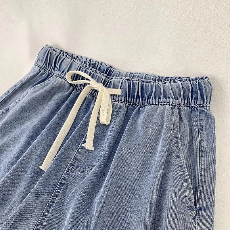 Damebukser i denim med snøre og brede ben