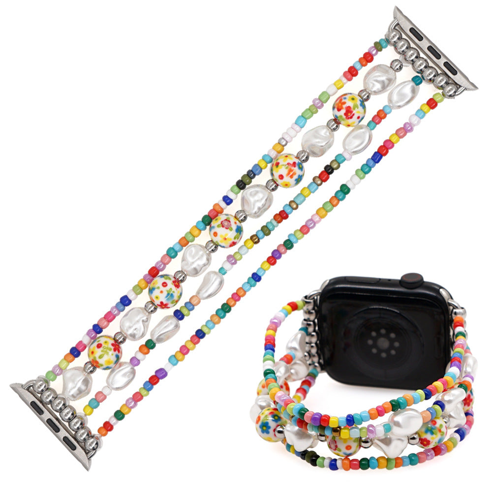 Smykkerem til ur med perler af blødt keramik og glas