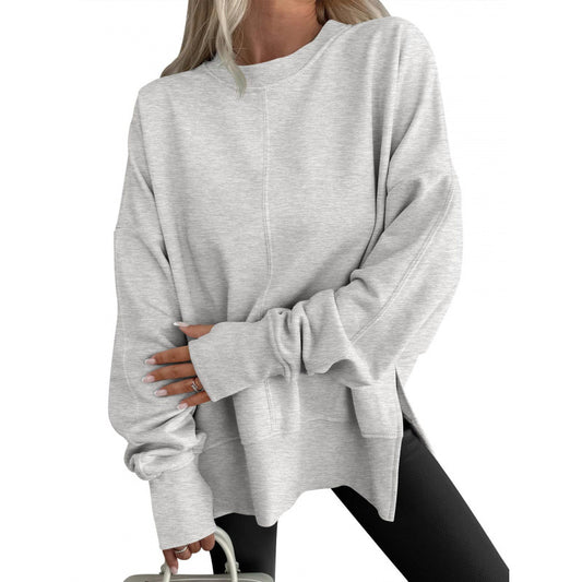 Løs sweater med sideslids, patchwork, rund hals, flagermusærmer og velourhættetrøje