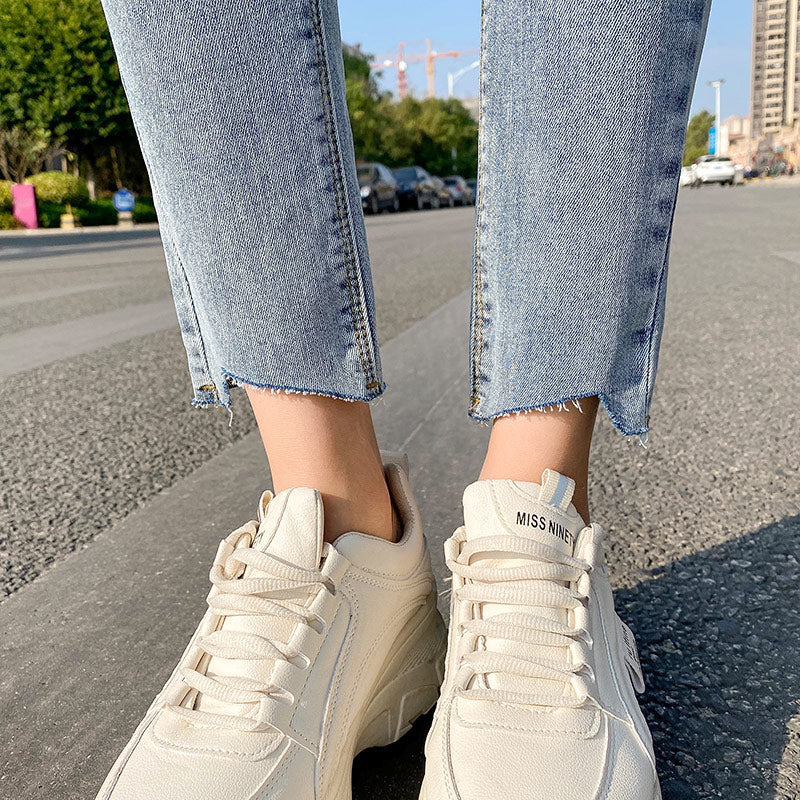 Lyseblå Ripped Jeans Til Kvinder Tynde Og Lange Ni-punkts Pencil Benbukser