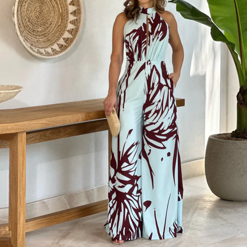 Sommerlig, elegant og moderigtig ærmeløs jumpsuit med halv rullekrave, print, hulmønster og snøret vidde ben