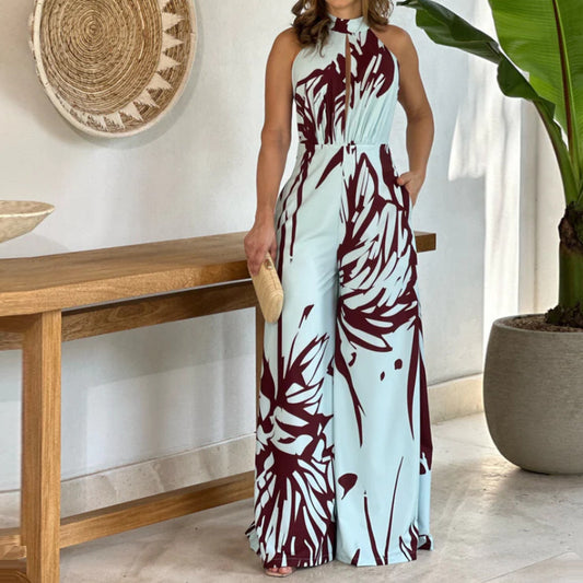 Sommerlig, elegant og moderigtig ærmeløs jumpsuit med halv rullekrave, print, hulmønster og snøret vidde ben
