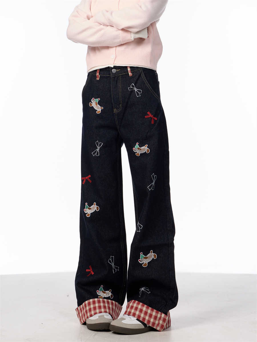 Vintage jeans med broderet sløjfe, hvalpemotiv og vide ben samt høj talje