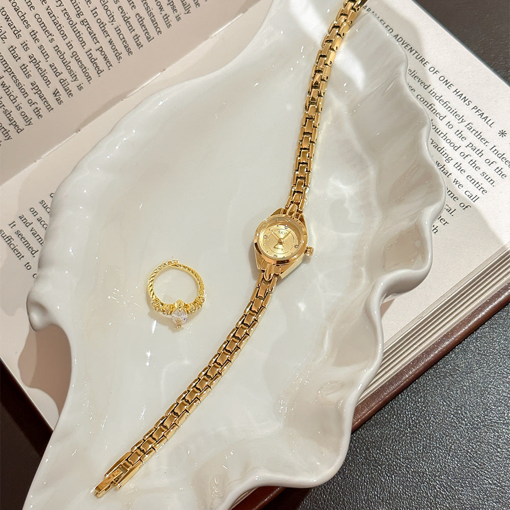 Retro Mid-centurystyle Gold Bracelet Watch With A Niche Design-forward Aesthetic