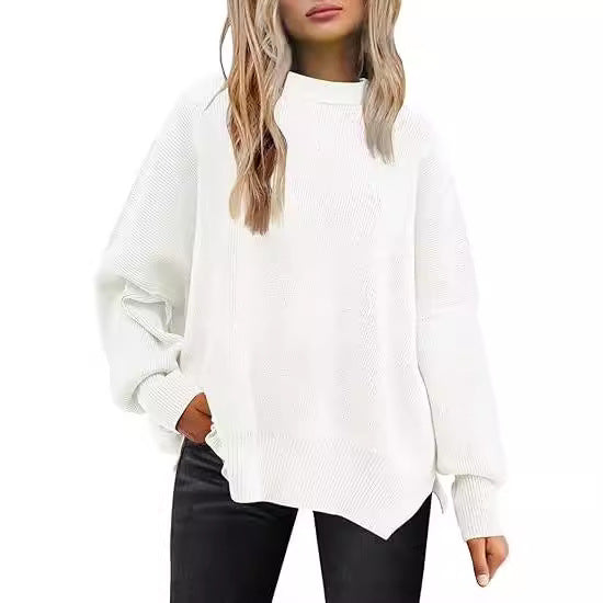 Strikket sweater med rund hals, løs pasform og slidser i siderne. Ensfarvet sweater med flagermusærmer til kvinder.