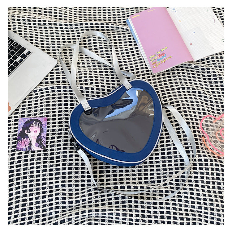 Enkel alt-matchende hjerteformet gennemsigtig hånd-crossbody-taske