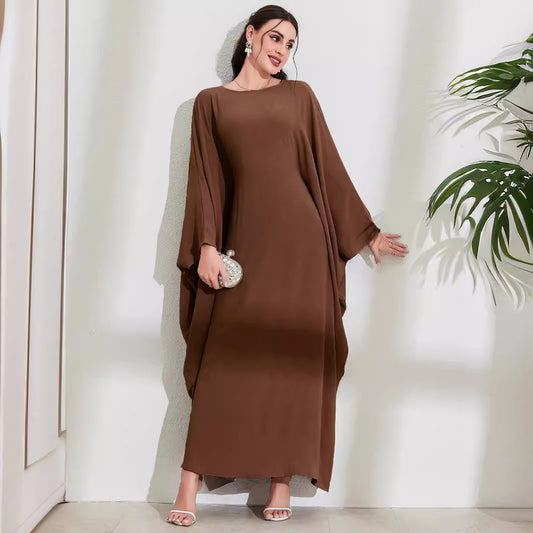Long Dress With Tie Details Batwing Sleeves And A Round Necklinestylish And Elegant