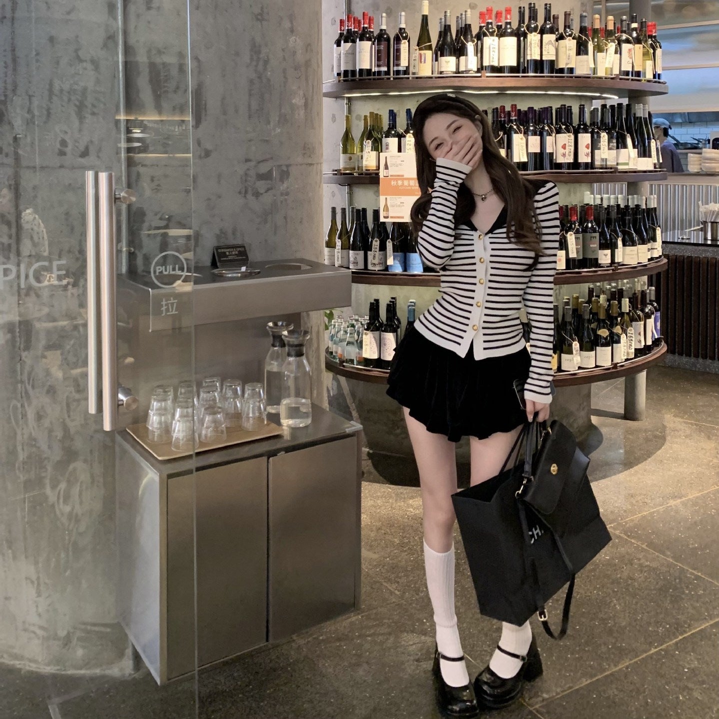 Black And White Striped Knit Top With A Naval-style Collar Designed For A Slim Fit