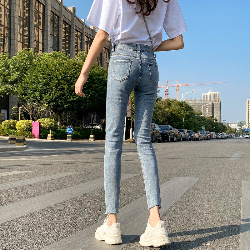 Lyseblå Ripped Jeans Til Kvinder Tynde Og Lange Ni-punkts Pencil Benbukser