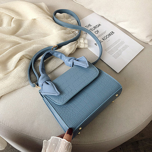 Stone-grained shoulder-slung crossbody bag