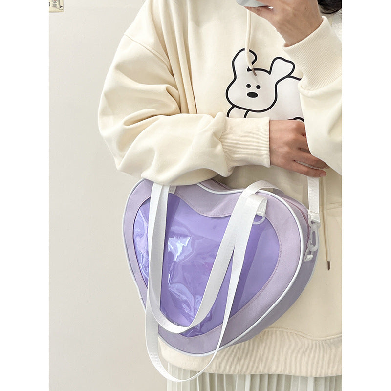 Enkel alt-matchende hjerteformet gennemsigtig hånd-crossbody-taske