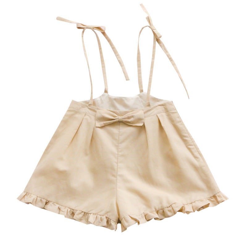 Bow-tied flounces with suspenders