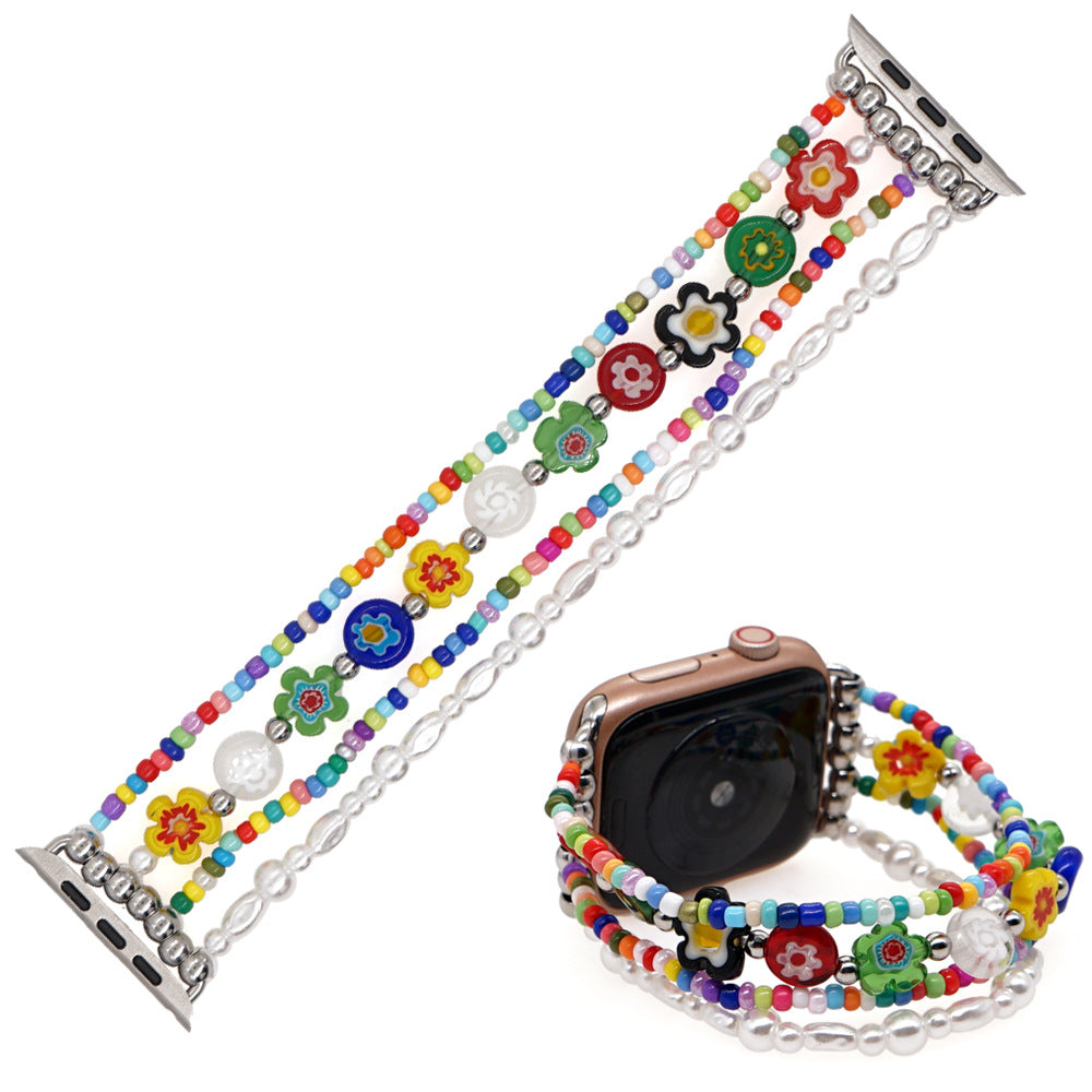 Smykkerem til ur med perler af blødt keramik og glas