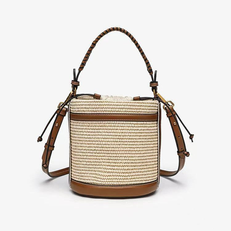 Brown Cylindrical Tote Bag With Dual Handles, Designed For Handheld Or Crossbody Wear