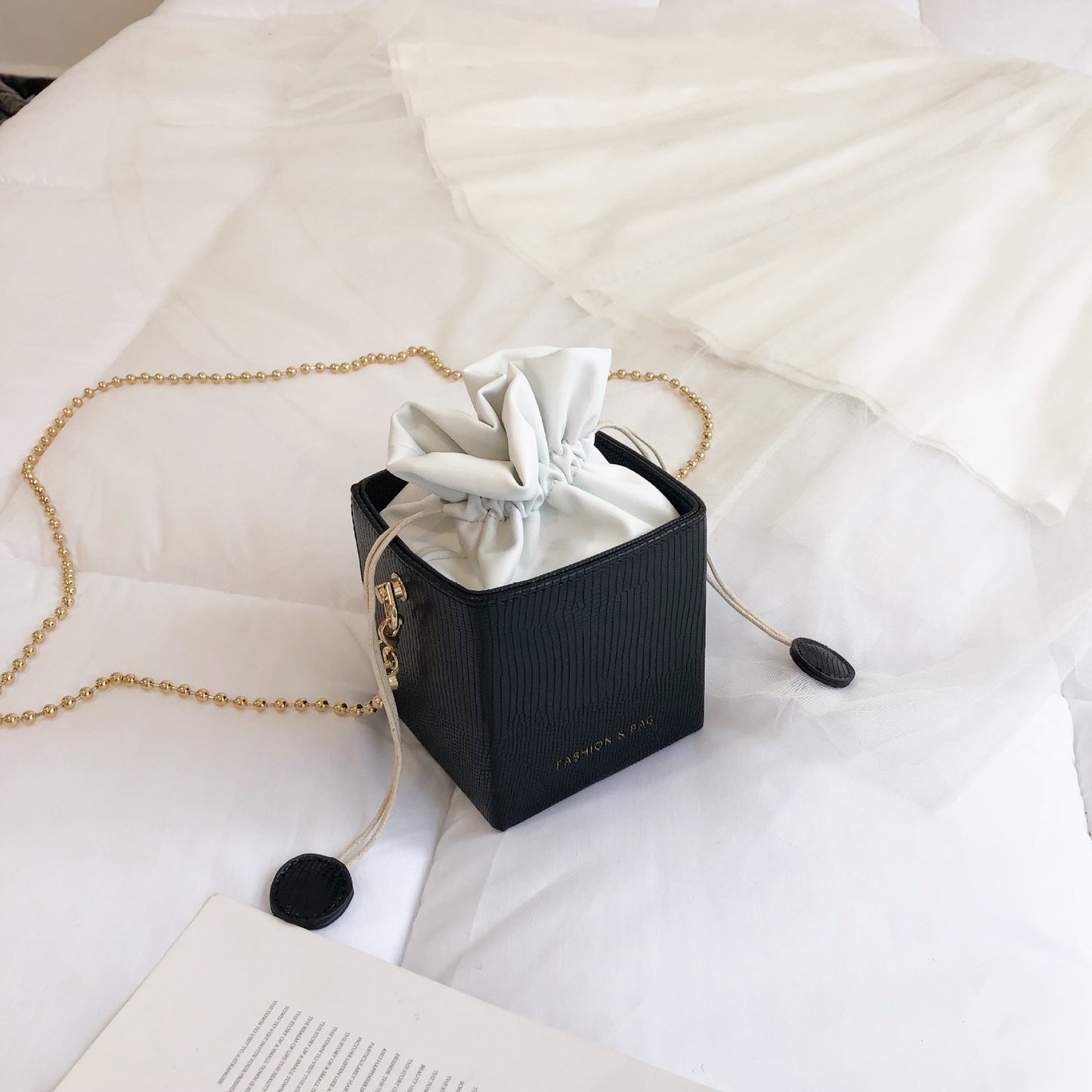 Chain drawstring crossbody bag