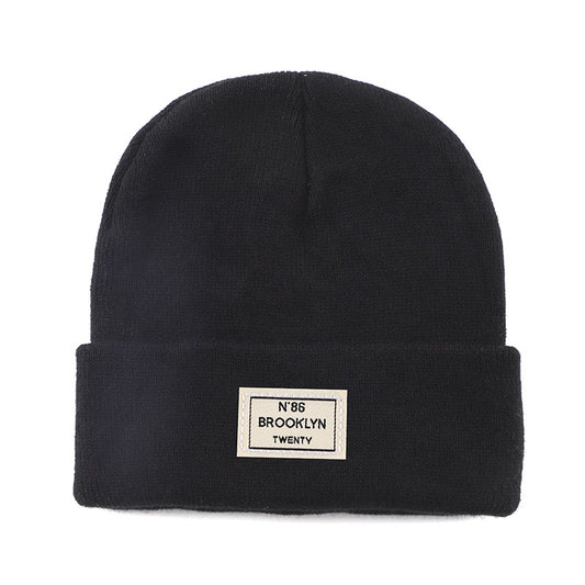 Knitted Beanie With Brand Label Stylish And Fashionable