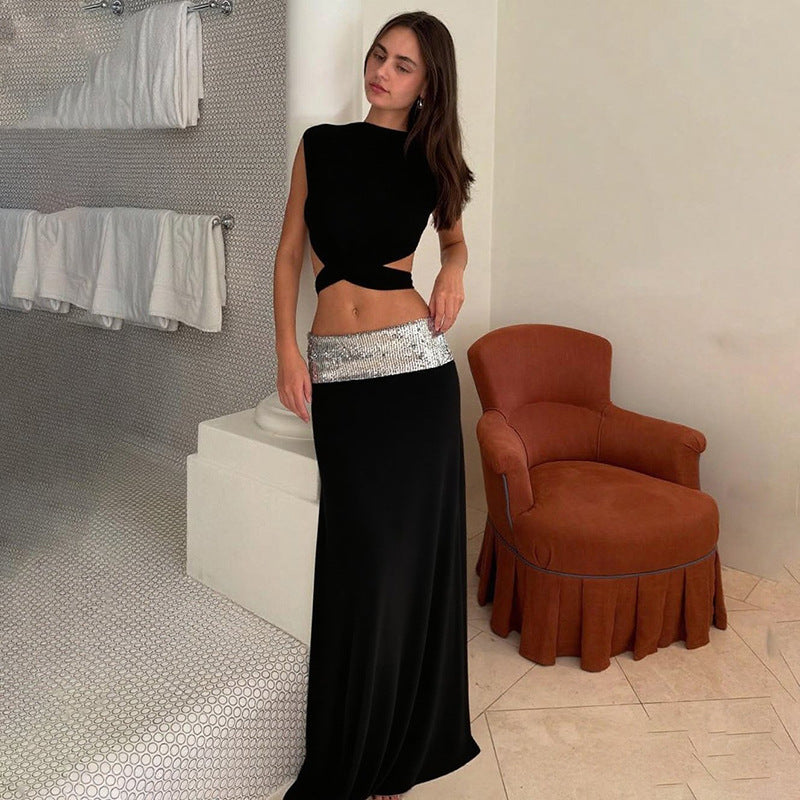 And Elegant Backless Top Paired With A Patchwork Maxi Skirt