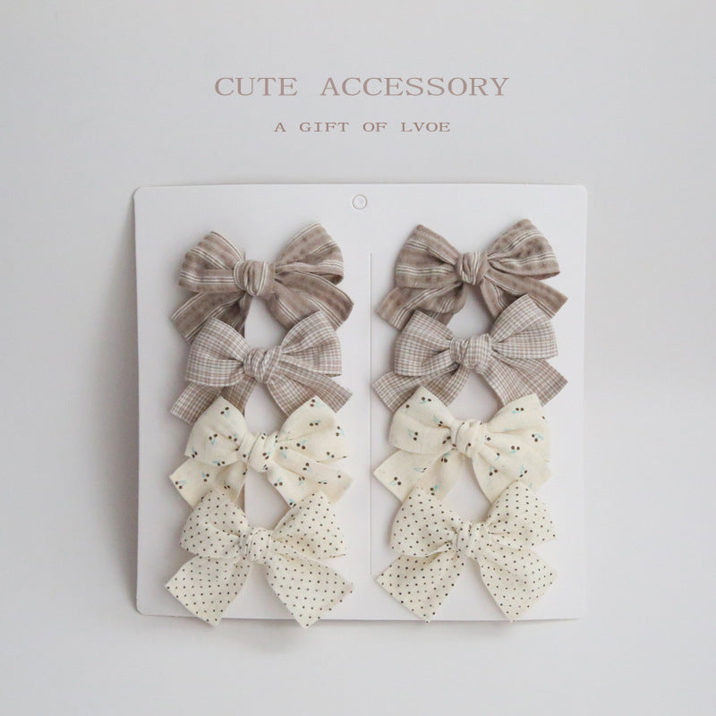 Dovetail Bow Around A Pair Of Hairclips 1 Group