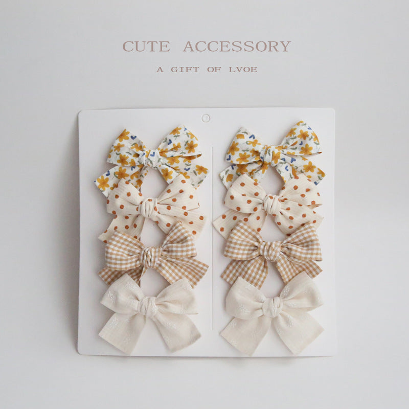 Dovetail Bow Around A Pair Of Hairclips 1 Group