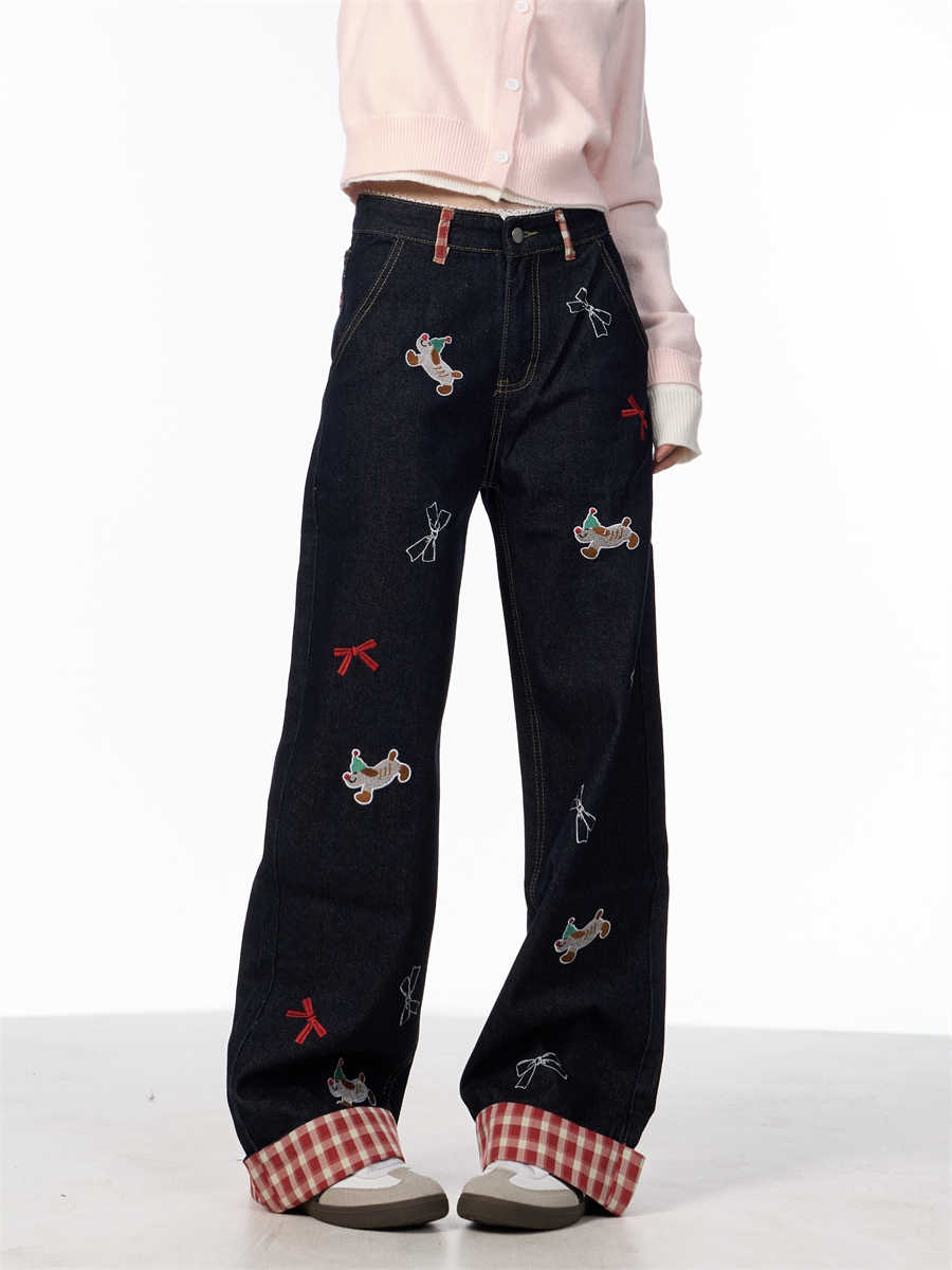 Vintage jeans med broderet sløjfe, hvalpemotiv og vide ben samt høj talje