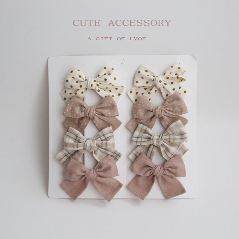 Dovetail Bow Around A Pair Of Hairclips 1 Group
