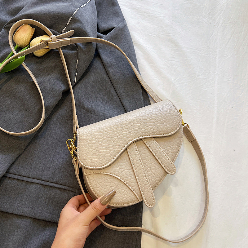 Enkel skuldertaske til kvinder i saddelstil (crossbody)