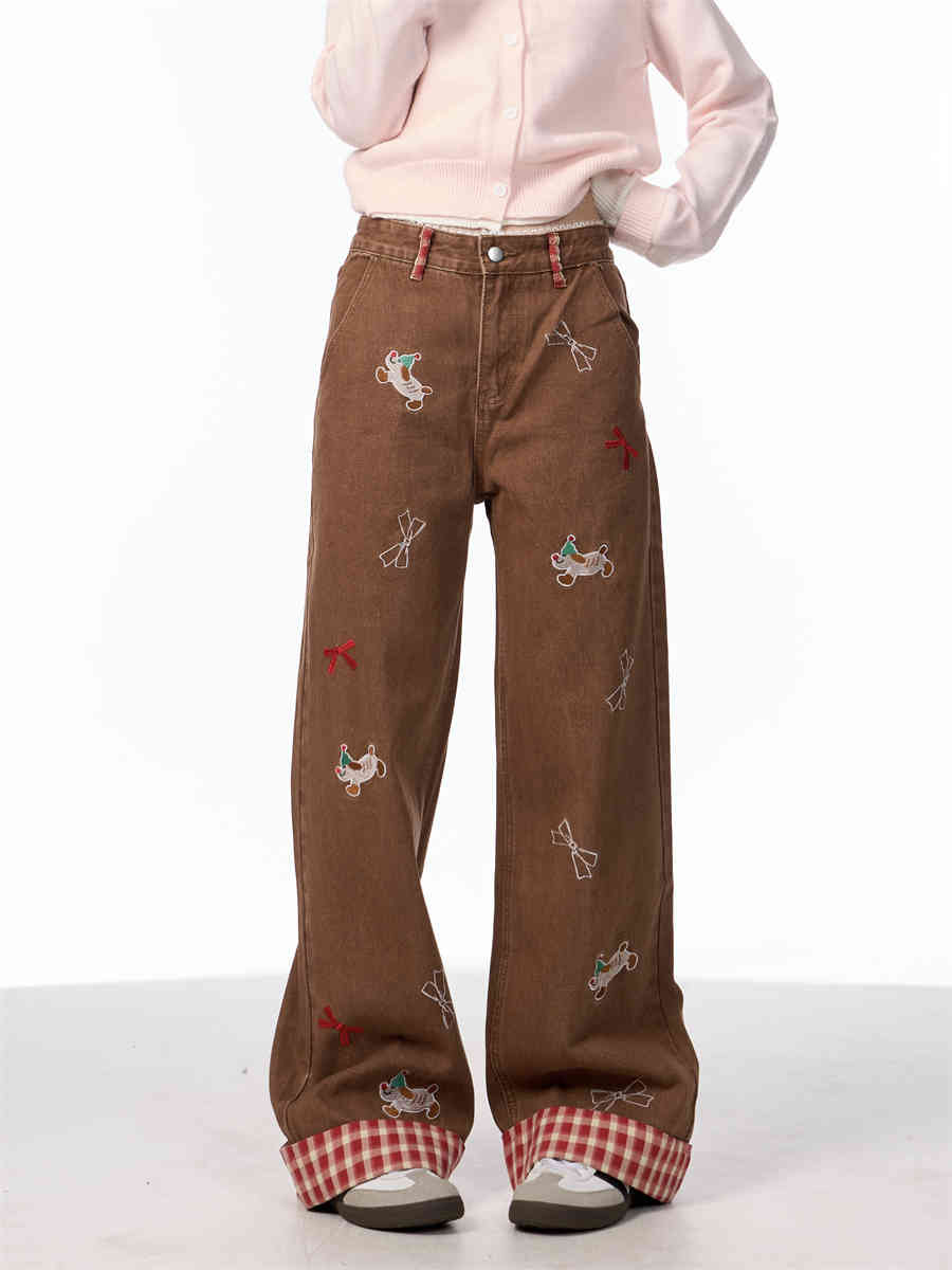 Vintage jeans med broderet sløjfe, hvalpemotiv og vide ben samt høj talje