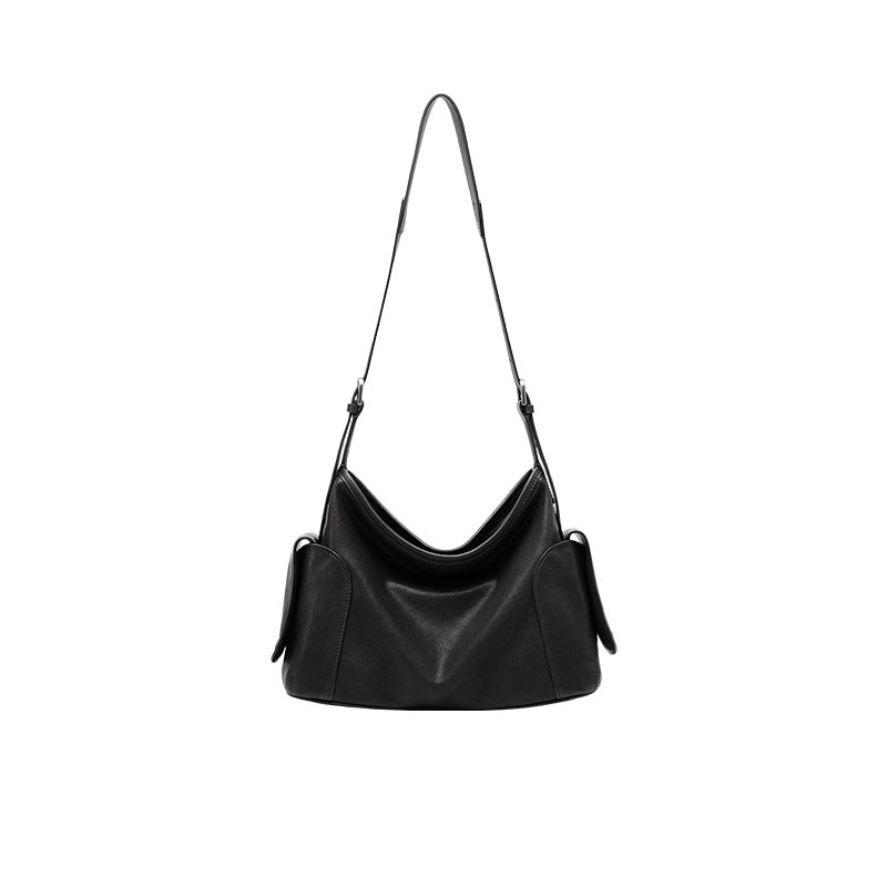 Stor crossbody-taske i ægte læder med to hanke