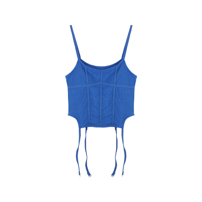 A Woman Wearing A Suspender Vest With A Chest Pad.